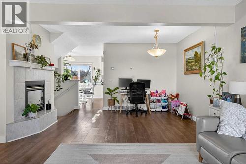 41 Sandarac Villas Nw, Calgary, AB - Indoor Photo Showing Living Room With Fireplace