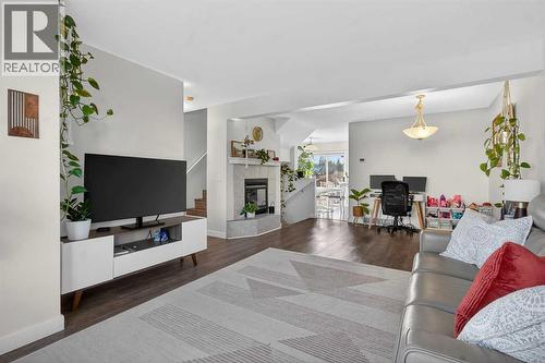 41 Sandarac Villas Nw, Calgary, AB - Indoor Photo Showing Living Room With Fireplace