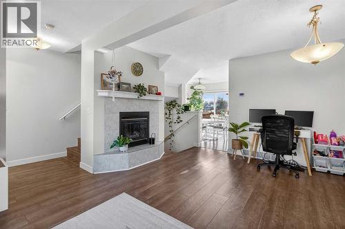 41 Sandarac Villas Nw, Calgary, AB - Indoor With Fireplace