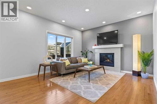 184 Masters Rise Se, Calgary, AB - Indoor Photo Showing Living Room With Fireplace