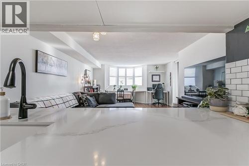 Living room with a desk, healthy amount of natural light, and wood finished floors - 3845 Lakeshore Boulevard W Unit# 804, Etobicoke, ON - Indoor