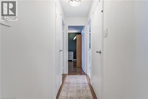 Corridor featuring dark wood-style floors and baseboards - 3845 Lakeshore Boulevard W Unit# 804, Etobicoke, ON - Indoor Photo Showing Other Room