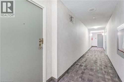 Hall featuring carpet floors and a textured ceiling - 3845 Lakeshore Boulevard W Unit# 804, Etobicoke, ON - Indoor Photo Showing Other Room