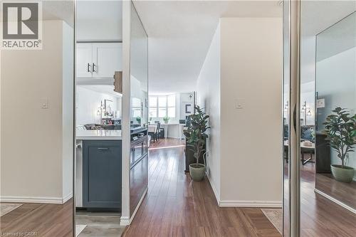 Hallway with dark wood-style flooring and baseboards - 3845 Lakeshore Boulevard W Unit# 804, Etobicoke, ON - Indoor Photo Showing Other Room