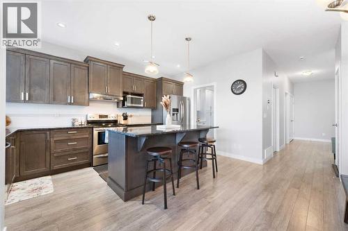 153 Williamstown Park Nw, Airdrie, AB - Indoor Photo Showing Kitchen With Upgraded Kitchen
