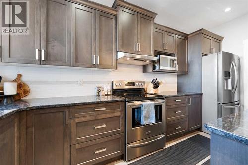 153 Williamstown Park Nw, Airdrie, AB - Indoor Photo Showing Kitchen With Upgraded Kitchen