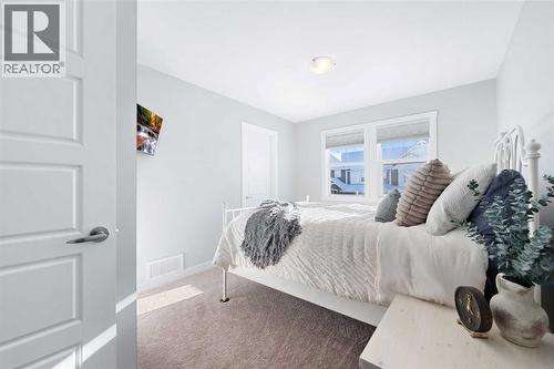 153 Williamstown Park Nw, Airdrie, AB - Indoor Photo Showing Bedroom