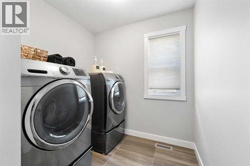 153 Williamstown Park Nw, Airdrie, AB - Indoor Photo Showing Laundry Room
