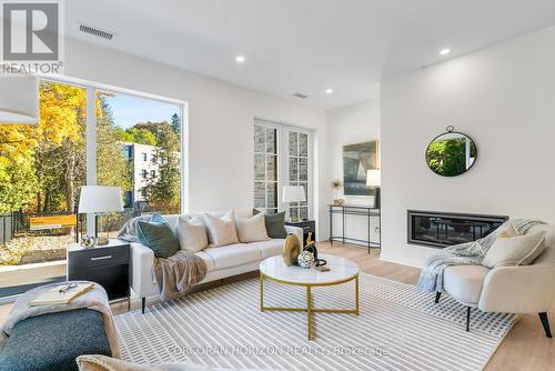 32 - 6523 Wellington 7 Road, Centre Wellington, ON - Indoor Photo Showing Living Room With Fireplace