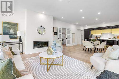 32 - 6523 Wellington 7 Road, Centre Wellington, ON - Indoor Photo Showing Living Room With Fireplace