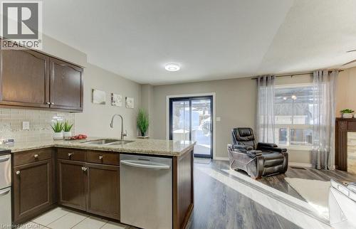 23 Michelle Court, Kitchener, ON - Indoor Photo Showing Kitchen With Fireplace With Double Sink