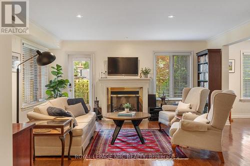 101 - 55 Main Street, St. Catharines (Port Dalhousie), ON - Indoor Photo Showing Living Room With Fireplace
