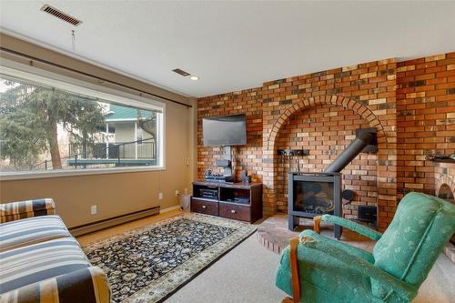 3985 15 Avenue, Vernon, BC - Indoor Photo Showing Living Room With Fireplace