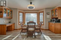 BREAKFAST AREA WITH CUSTOM CABINETRY - 