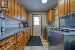 LAUNDRY/ MUDROOM W/ACCESS TO BACK YARD AND  3RD GA - 