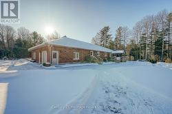 BACK/SIDE WITH 3RD GARAGE SPACE - 