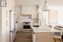 Cafe Appliances, Custom Cabinetry, Pendent Lights - 