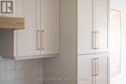 Standard Selection Cabinetry and Gold Hardware - 