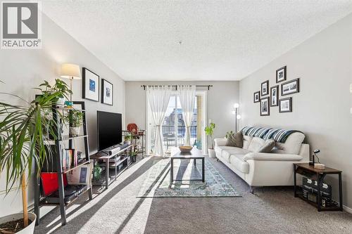 1215, 8810 Royal Birch Boulevard, Calgary, AB - Indoor Photo Showing Living Room