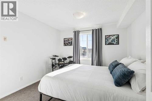 1215, 8810 Royal Birch Boulevard, Calgary, AB - Indoor Photo Showing Bedroom