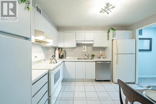 408 - 1400 Dixie Road, Mississauga, ON - Indoor Photo Showing Kitchen With Double Sink