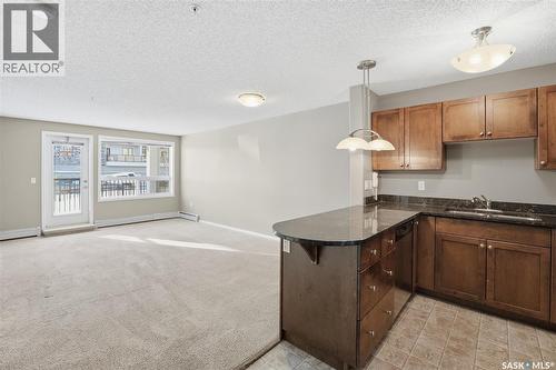 118 150 Pawlychenko Lane, Saskatoon, SK - Indoor Photo Showing Kitchen With Double Sink