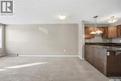 118 150 Pawlychenko Lane, Saskatoon, SK - Indoor Photo Showing Kitchen With Double Sink