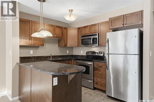 118 150 Pawlychenko Lane, Saskatoon, SK - Indoor Photo Showing Kitchen With Double Sink