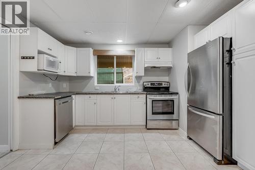 Lower-level suite kitchen with functional layout and private entrance. - 2034 Horizon Drive, West Kelowna, BC - Indoor Photo Showing Kitchen