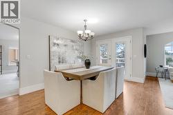 Open dining area conveniently located off the kitchen, ideal for family meals and gatherings. - 