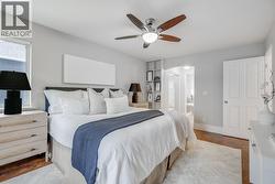 Spacious primary bedroom with ensuite and natural light. - 