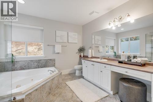 Four-piece ensuite with soaker tub and functional layout. - 2034 Horizon Drive, West Kelowna, BC - Indoor Photo Showing Bathroom