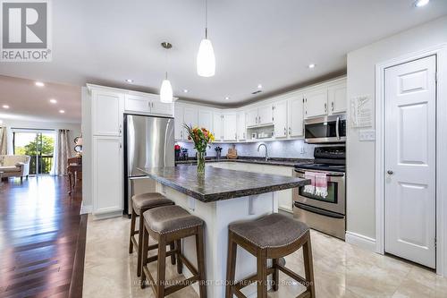Modern kitchen With Centre Island & Breakfast Bar - 61 Druan Drive, Kawartha Lakes (Mariposa), ON - Indoor Photo Showing Kitchen With Upgraded Kitchen