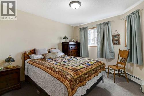 206, 12015 Royal Oaks Drive, Grande Prairie, AB - Indoor Photo Showing Bedroom