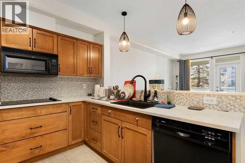 212, 3111 34 Avenue Nw, Calgary, AB - Indoor Photo Showing Kitchen With Upgraded Kitchen