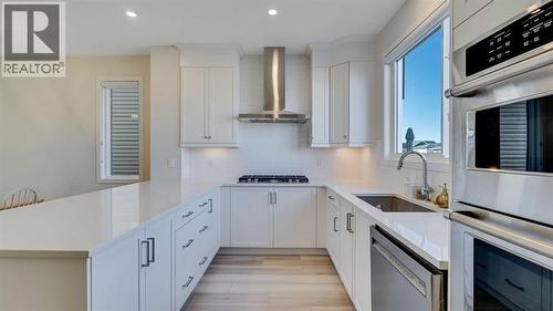 18 Amblehurst Path Nw, Calgary, AB - Indoor Photo Showing Kitchen With Upgraded Kitchen