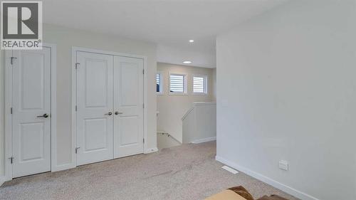 18 Amblehurst Path Nw, Calgary, AB - Indoor Photo Showing Other Room