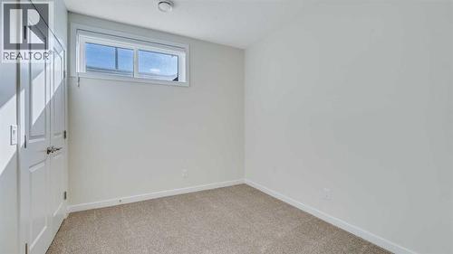 18 Amblehurst Path Nw, Calgary, AB - Indoor Photo Showing Other Room