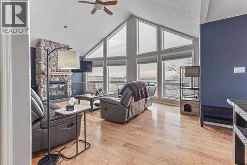 95048 River Ridge Road, Rural Lethbridge County, AB - Indoor With Fireplace