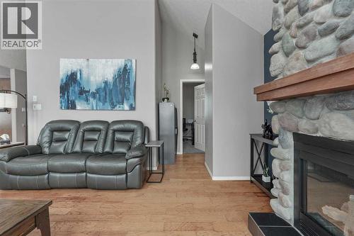 95048 River Ridge Road, Rural Lethbridge County, AB - Indoor Photo Showing Living Room With Fireplace