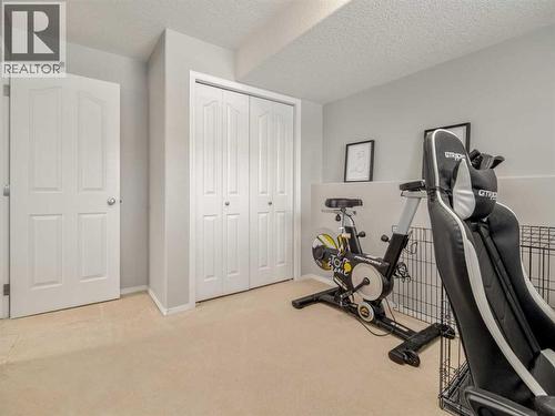 109 Peigan Court W, Lethbridge, AB - Indoor Photo Showing Gym Room