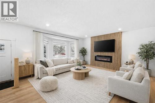 2404 51 Street Ne, Calgary, AB - Indoor Photo Showing Living Room With Fireplace