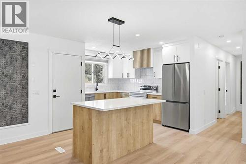 Kitchen main - 2404 51 Street Ne, Calgary, AB - Indoor Photo Showing Kitchen With Upgraded Kitchen