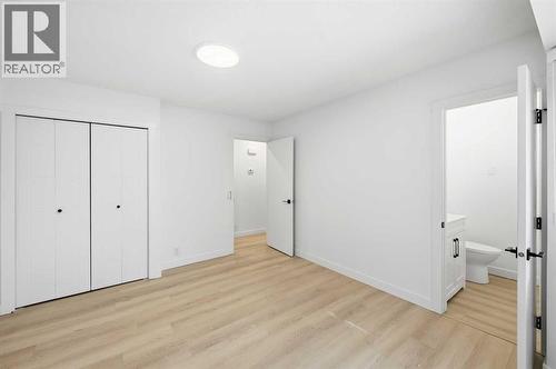 Primary bedroom - 2404 51 Street Ne, Calgary, AB - Indoor Photo Showing Other Room