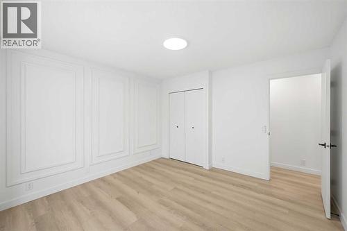 Primary bedroom - 2404 51 Street Ne, Calgary, AB - Indoor Photo Showing Other Room