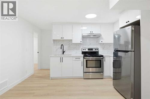 Basement Kitchen - 2404 51 Street Ne, Calgary, AB - Indoor Photo Showing Kitchen With Upgraded Kitchen
