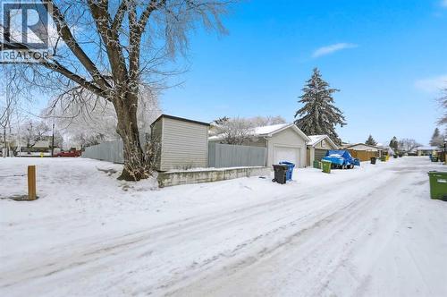 Rear alley garage view - 2404 51 Street Ne, Calgary, AB - Outdoor
