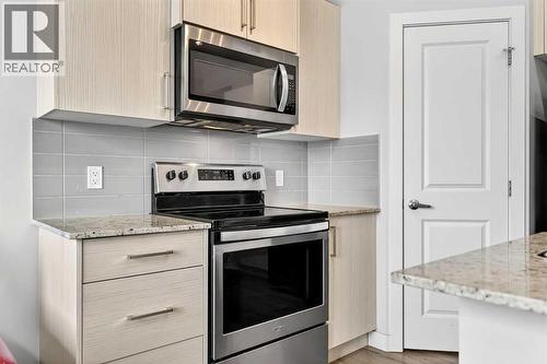 403 Sage Hill Grove Nw, Calgary, AB - Indoor Photo Showing Kitchen With Upgraded Kitchen
