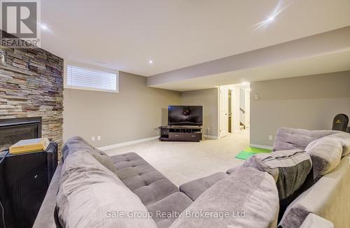 117 Juno Crescent, Woodstock (Woodstock - North), ON - Indoor Photo Showing Basement With Fireplace