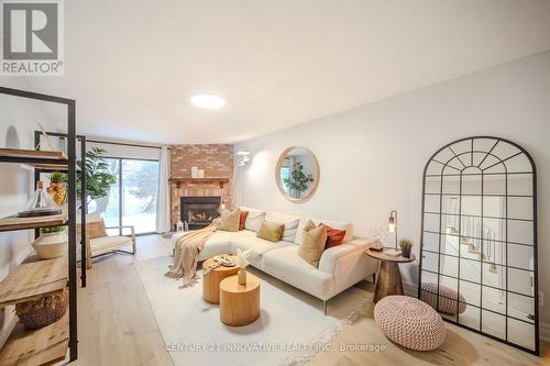 20 Muirbank Boulevard, Toronto, ON - Indoor Photo Showing Living Room With Fireplace
